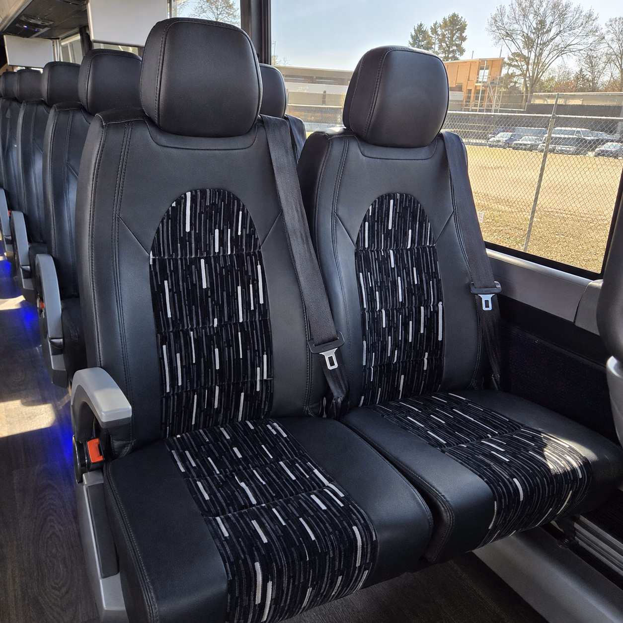 charter bus shuttles between grand rapids and the michigan state capitol
